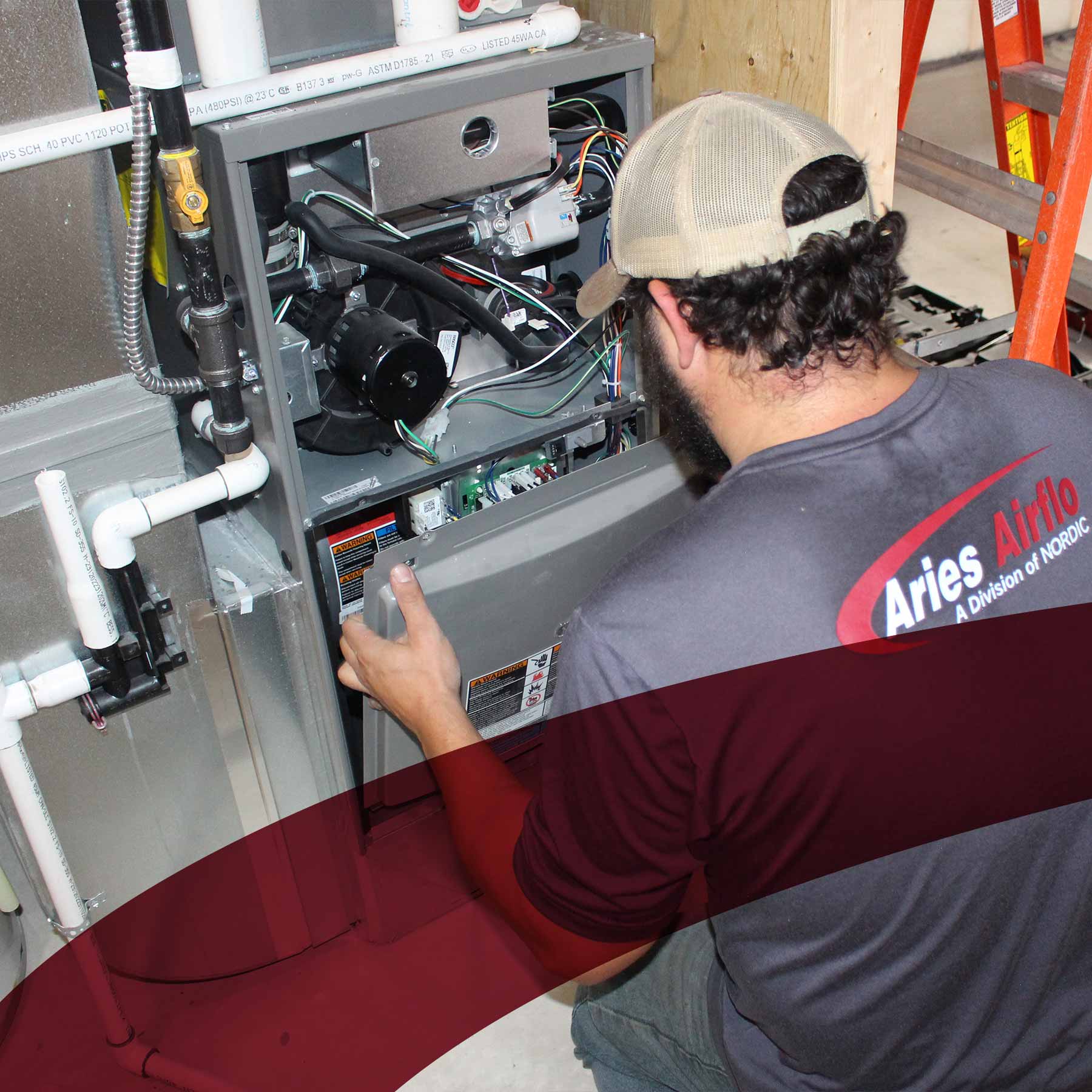 aries worker inspecting a control box