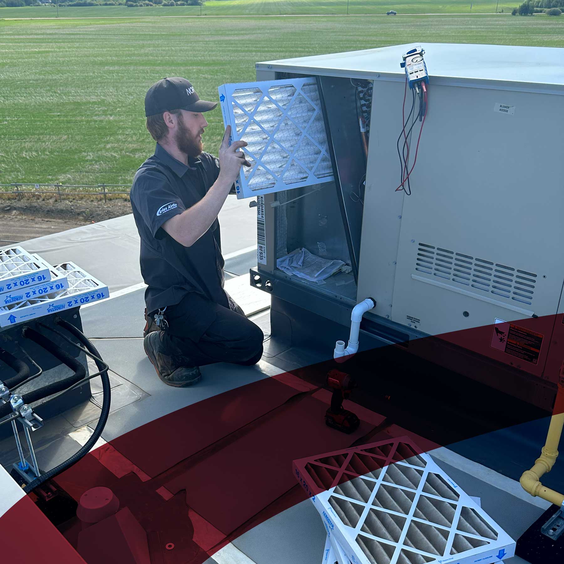 aries worker replacing a filter with branding red mark